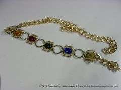 BAG: 2 FASHION GOLD TONE BELTS, 1 W/ LEAF PATTERN, 1 W/ COLORED GLASS STONES