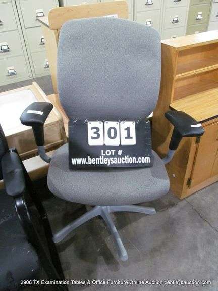 GREY UPHOLSTERED DESK CHAIR (WHEELS ARE BROKEN OFF)