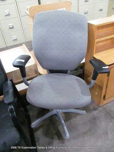 GREY UPHOLSTERED DESK CHAIR (WHEELS ARE BROKEN OFF)