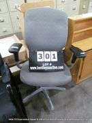 GREY UPHOLSTERED DESK CHAIR (WHEELS ARE BROKEN OFF)