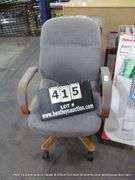 BLUE CUSHIONED VINTAGE WOODEN OFFICE ROLLING CHAIR