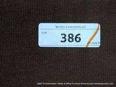 BROWN UPHOLSTERED CHAIR