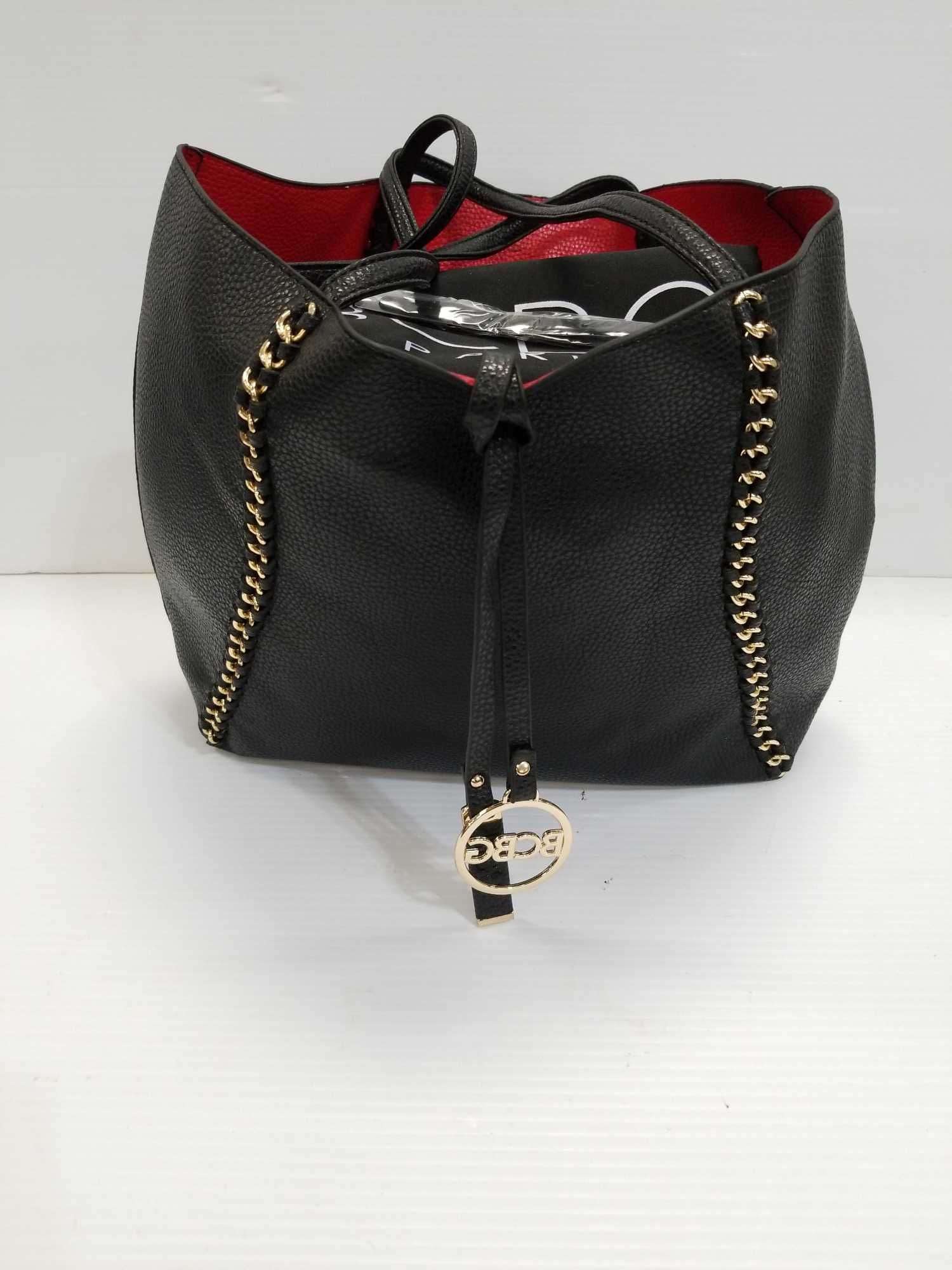 Black with gold accent bag marked BCBG - Bid-Assets Online 