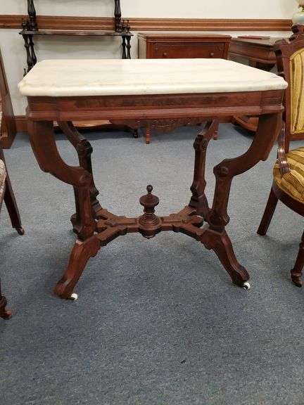 Antique victorian marble top table with porcelain castors.28w x 20l x 30h