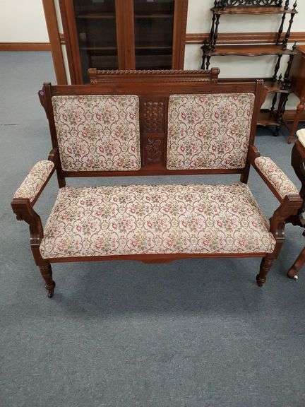 Floral padded settee with floral accents. Very nice! measures 51in.