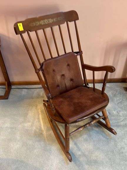 Stenciled spindle back rocker with brown microfiber cushions (removable)