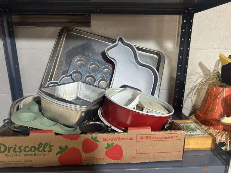 2 Shelves with kitchen supplies including plastic containers, wax paper