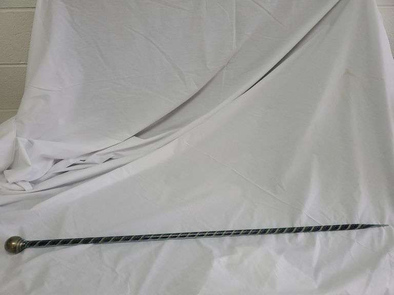 Antique whimsical hand blown glass cane featuring twisted shades of green, blue and burgundy. Measures 46 in long. Tiny chip on bottom tip. See photos