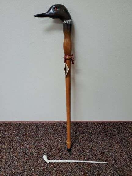 Country traditions hand carved wood waterfowl cane by Canadian craftsman Ron Sadler measures 34 in long , white clay pipe measuring 16 in long..