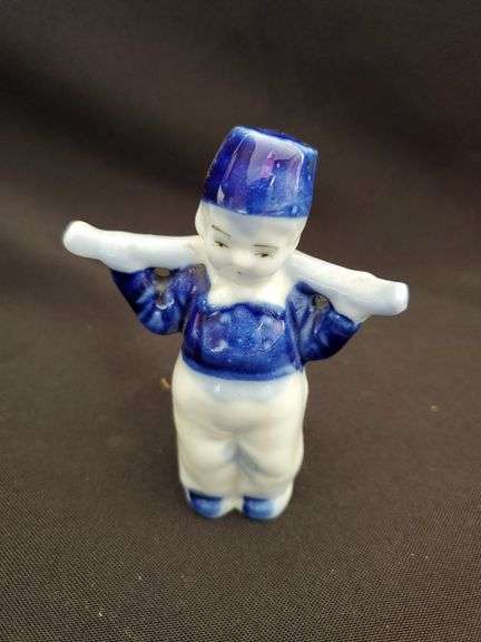 Delft blue bisque water boy figurine, pipe and collectors pieces 7 book
