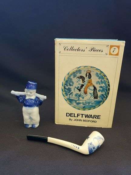 Delft blue bisque water boy figurine, pipe and collectors pieces 7 book