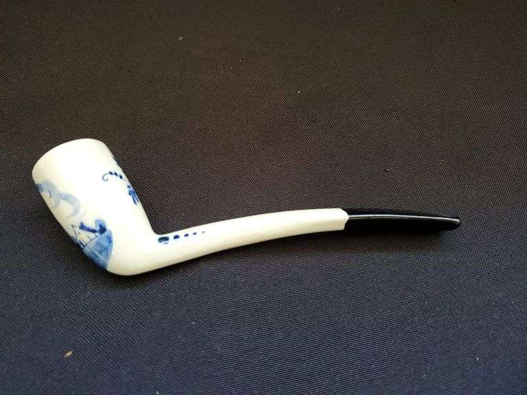 Delft blue bisque water boy figurine, pipe and collectors pieces 7 book