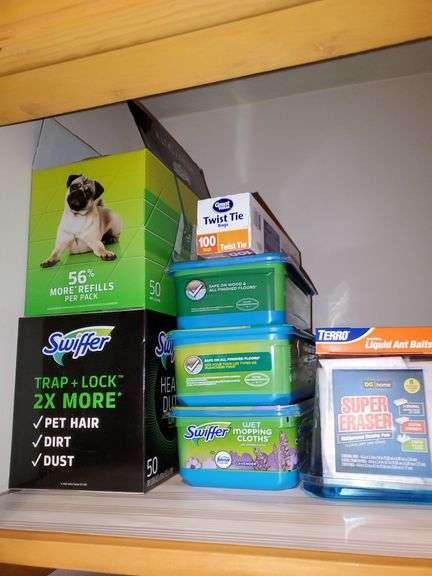 Hall closet contents includes Swiffer wet mop cloths and dry mop cloths, Swiffer mops, magic erasers, latex gloves, garbage bags, O-Cedar broom and dustpan, Swiffer mops, bona wood floor mop, scrub brushes, nitrile gloves, assorted cleaners, gift bag tissue paper, cleaning buckets, cloth bags. See photos
