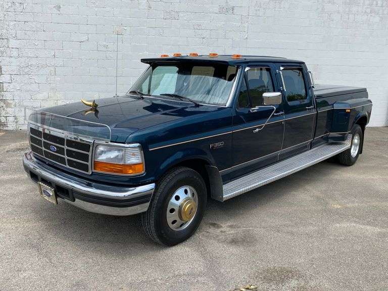 1997 Ford F-350 XLT dually long bed pickup truck. VIN 1FTJW35G8VE800805,  w/19,600 miles, 7.5 L (460 cu. in gas V8), auto trans. A.R.E. fiberglass tonneau cover on bed, alum wheels, ONE OWNER in Youngstown, OH. The exterior color is Hunter Green and the interior is Mocha colored cloth.  There is a 2"x2" trailer hitch receiver.  There is also a list of after market accessories that the owner installed. The title shows the vehicle was transferred out the the original owners name to his son't name 