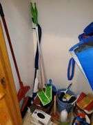 Hall closet contents includes Swiffer wet mop cloths and dry mop cloths, Swiffer mops, magic erasers, latex gloves, garbage bags, O-Cedar broom and dustpan, Swiffer mops, bona wood floor mop, scrub brushes, nitrile gloves, assorted cleaners, gift bag tissue paper, cleaning buckets, cloth bags. See photos
