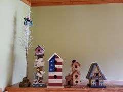 (4) decorative wooden birdhouses, bird in tree.