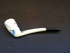 Delft blue bisque water boy figurine, pipe and collectors pieces 7 book
