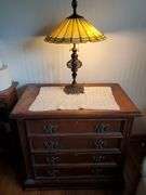 2-Drawer oakwood dresser with brass lamp