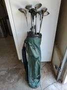 Spalding nylon golf bag with assorted drivers, sand wedge and putter. Includes two pairs of size 8 golf shoes by Ecco and FootJoy. See photos.