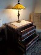 2-Drawer oakwood dresser with brass lamp