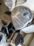Spalding nylon golf bag with assorted drivers, sand wedge and putter. Includes two pairs of size 8 golf shoes by Ecco and FootJoy. See photos.
