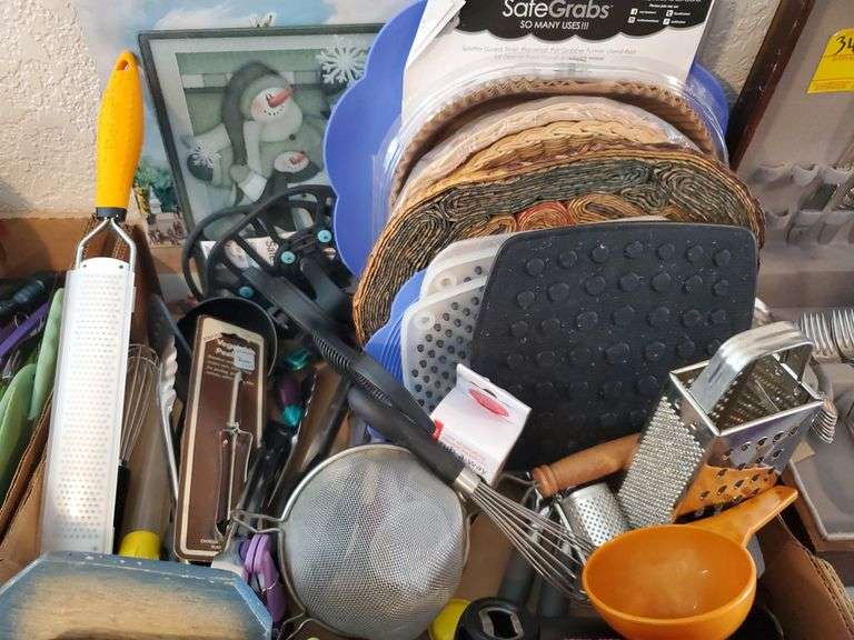 2 Home Kitchen boxes including Heat Resistant Pads, Graters, Strainers, Whisks, Measuring Cups, Can opener, Rolling Pins, Decor, and More