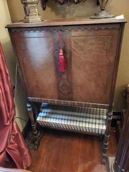 Drop front secretary with inlaid wood design.  49x29x13. No other contents included.