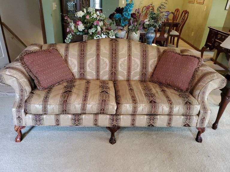 Hickory Hill Furniture corporation, Chippendale style sofa features wood claw and ball feet and includes matching accent pillows. Sofa measures 84 in wide. Living room