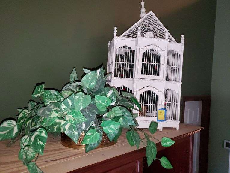 White birdhouse with tree inside measures 30 in tall by 16 in wide, artificial pothos plant in brass planter with grape design. Living room