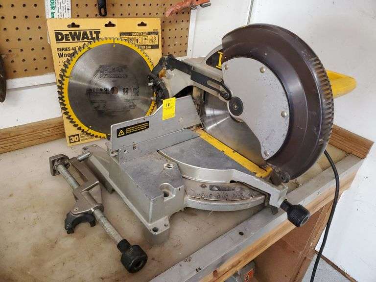 DeWalt model number DW705 12-in compound miter saw. Comes with extra blades and accessory. Power's on and works as it should. Garage