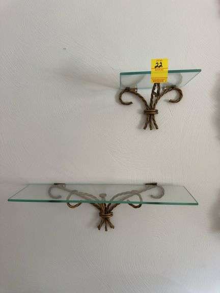 Two glass and metal decorative wall shelves