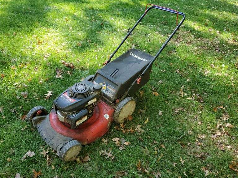 Troy-Bilt model 11A-B29Q711, 21-in rear bag, mold, side discharge mower with Honda high performance EZ start engine. Starts and runs as it should. Shed.