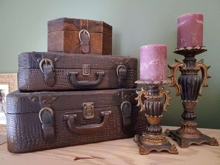Three decorative wood boxes, two ornate pillar candles. Living room