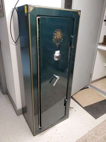 Sawmill safe Company gun safe measures 24 in W X 18 in D X 61 in H. Have combination. Located in basement. Heavy item. Bring adequate help.