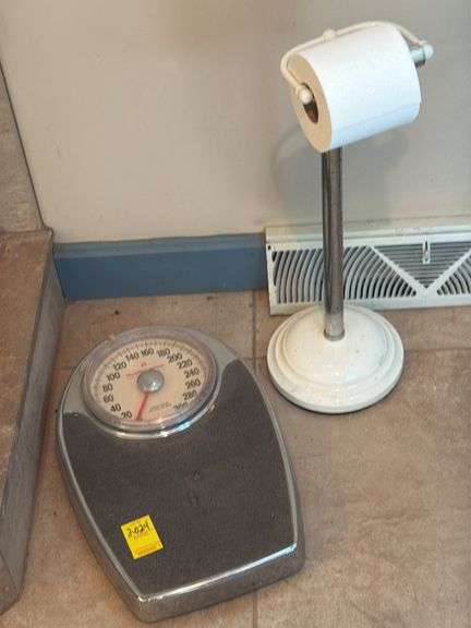 Floor stand toilet paper holder and Health- o-meter bath scale. Master bathroom