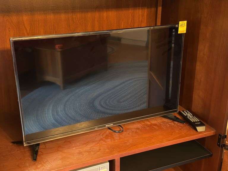 Sharp 32 inch flatscreen TV with remote. Master BR