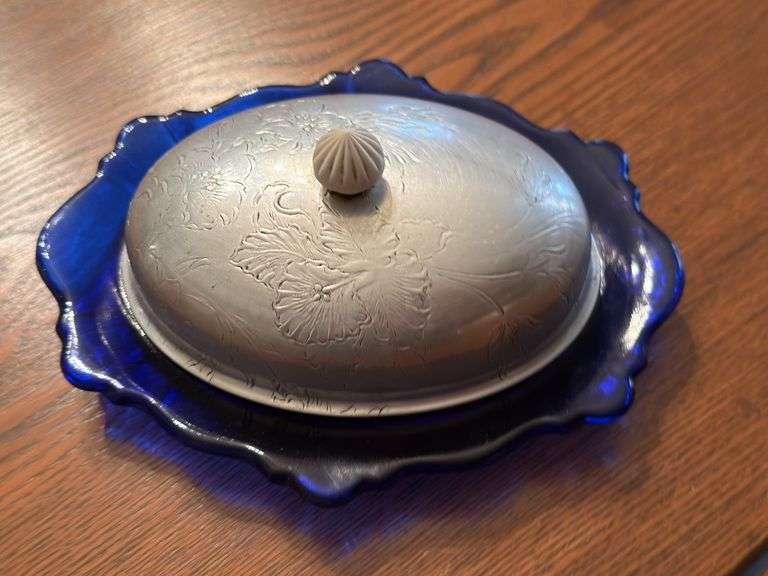 Holland candlestick, pr of International Silver candlesticks and other plus Empire pewter S&P, covered cobalt butter dish and mini bowl with candle. Dining room