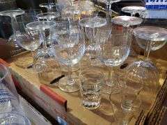 Barware glasses including red and white wine stems, shot glasses highball glasses, and more.