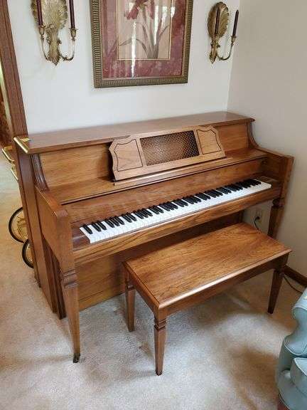 Vintage Everett piano with wood case designed by William g Faber. Measures 60 in wx 25 in DX 41 in H and includes lift top. living room