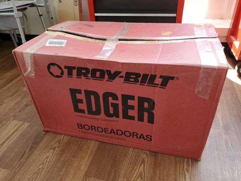 Troy-Bilt model number 25B-554E011, 158cc 4 cylinder Briggs & Stratton 500 series landscape edger with 9-in tri index blade. New in box.