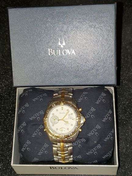 Bulova Millennia White/Yellow gold toned watch with original box. Inspect at preview.