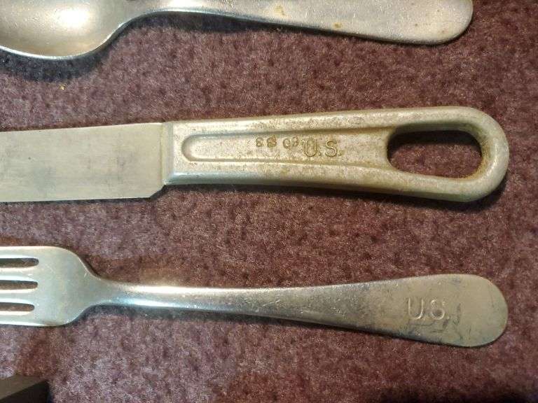 Copper and wood printing blocks, knife spoon fork marked U.S. Silicone Stainless, vintage gauze bandage boxes. Basement.