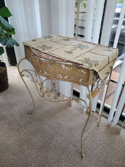 Wicker top and wrought iron framed plant stand with tropical runner measures 26 in WX 29 in H. Sunroom.