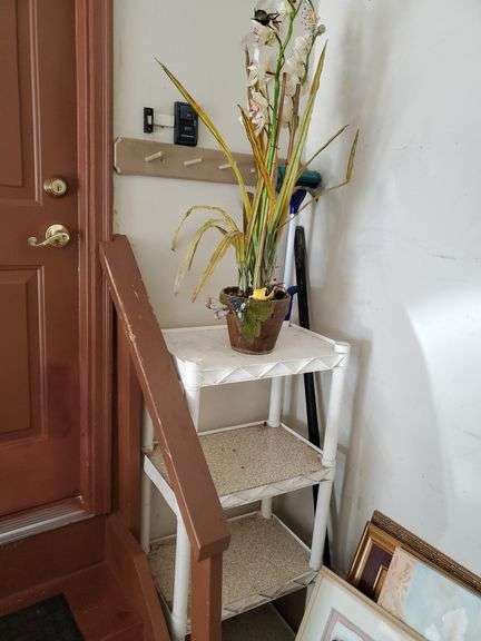 Adjustable composite shelving unit measuring 22 in W X 15 in D X 48 in h. Includes artificial planter and sponge mop. Garage