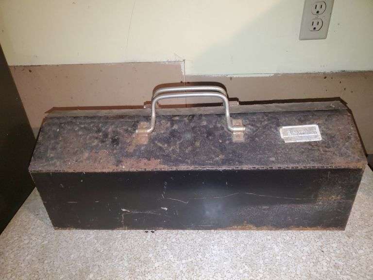 Sentry 21-in wide steel toolbox with removable top tray, half inch drive and 3/8 drive ratchets by Craftsman, miscellaneous sockets in 1/4, 3/8, 1/2 sockets by Craftsman and others, nut driver, ratchet extensions, miscellaneous wrenches by Craftsman and others. Basement Workshop.