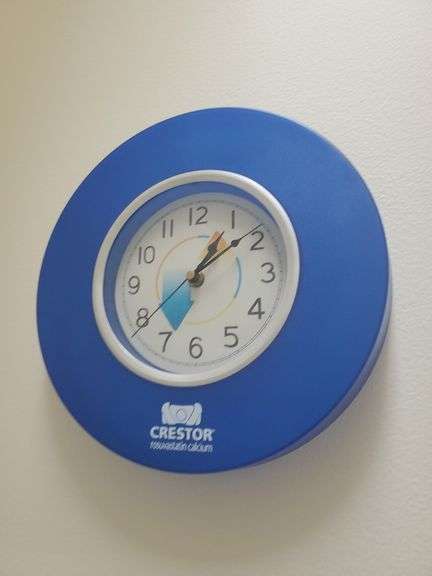 Bath Towels, Hand Towels, Wire Organizer Stand with contents, Ceramic Wall art, and Crestor Wall Clock