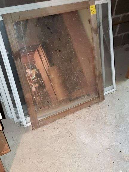 Wood framed mirror measures 22 in W x 27 in H