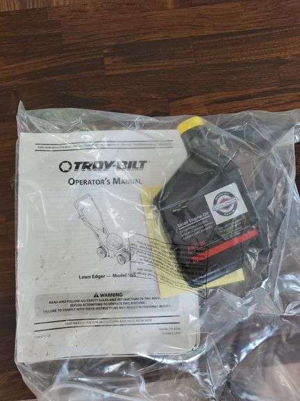 Troy-Bilt model number 25B-554E011, 158cc 4 cylinder Briggs & Stratton 500 series landscape edger with 9-in tri index blade. New in box.