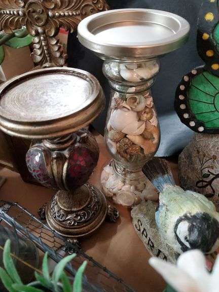 (2) box lot including (2) ceramic angel figurines, pillar candle holders, decorative crucifix, butterfly love stone, quartz mantle clock, ceramic teapot and heart-shaped trinket box. Garage