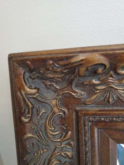 Ornate, bevel edged, wall mirror measures 33 in WX 45 in H.. Living room